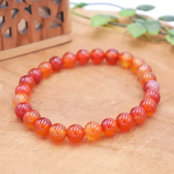 Bracelet en Cornaline naturelle de qualité supérieure, perles orange vif translucides montées sur fil élastique multibrin résistant.
