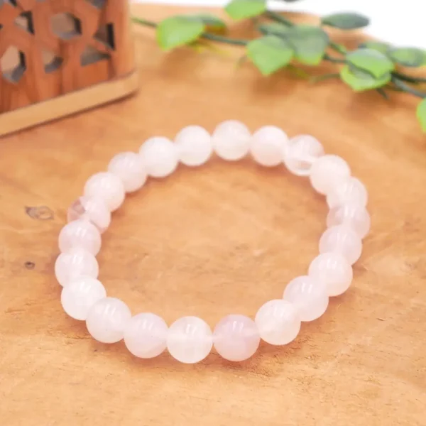 Bracelet en Quartz Rose naturel de qualité supérieure, perles rose poudré translucides à l'éclat vitreux sur fil élastique haute résistance.
