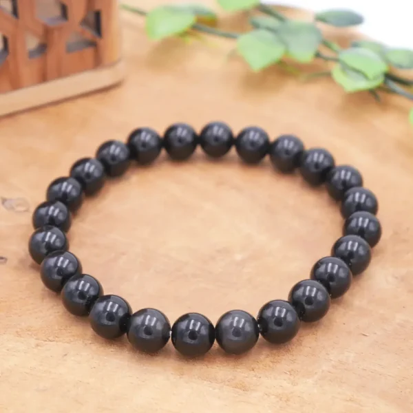 Bracelet en Obsidienne noire naturelle, perles au poli miroir d'un noir profond et intense, montage artisanal sur fil haute résistance.