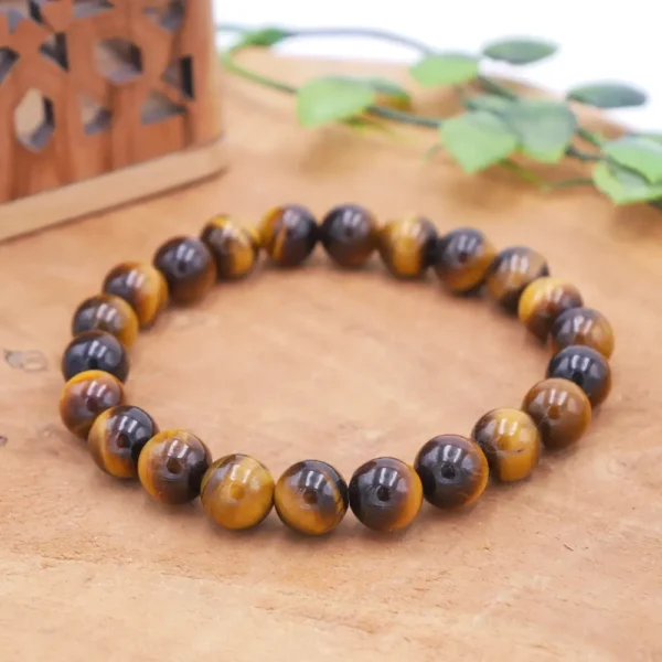 Bracelet en Œil de Tigre naturel de qualité supérieure, perles aux reflets dorés et marrons montées sur fil élastique multibrin haute résistance.