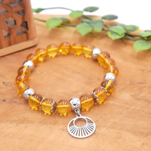 Bracelet en ambre naturel véritable sur fil élastique avec perles en acier inoxydable, fabriqué à la main.