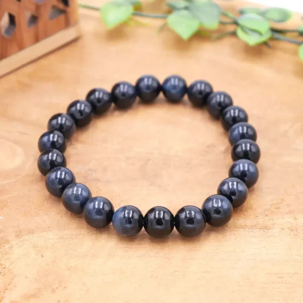 Bracelet en perles rondes d'œil de faucon naturel aux reflets bleu profond