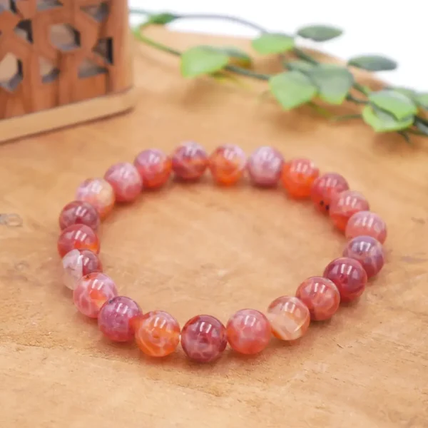 Bracelet en Agate Feu naturelle de qualité supérieure, perles aux reflets flamboyants et montage artisanal sur fil élastique multibrin résistant