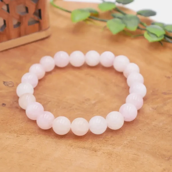 Bracelet en Morganite naturelle de qualité premium, perles translucides aux tons pastel rose, pêche et saumon sur fil résistant.