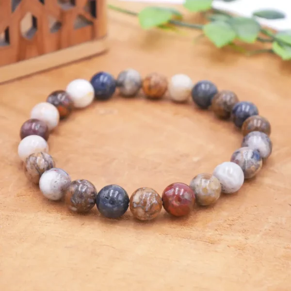 Bracelet en Piétersite naturelle de qualité rare, perles aux reflets chatoyants bleus et dorés montées sur fil élastique multibrin haute résistance.