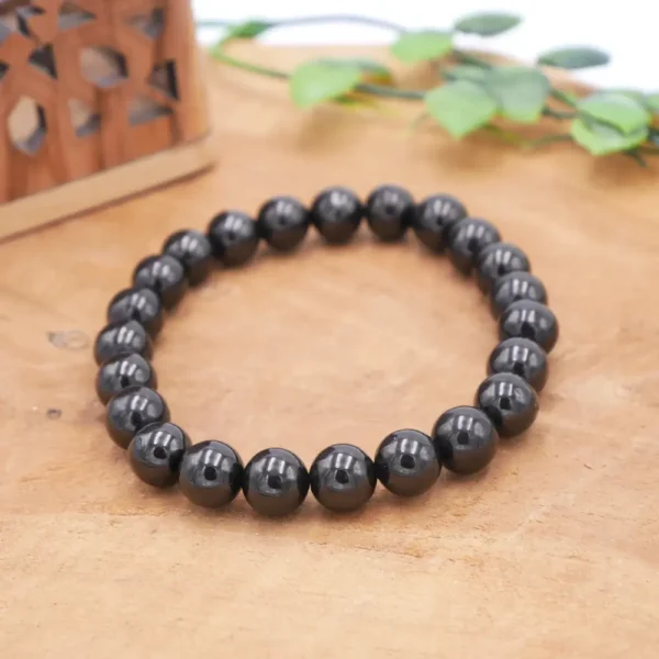 Bracelet en Jais naturel de qualité supérieure, perles noires intenses polies montées sur fil élastique multibrin haute résistance.