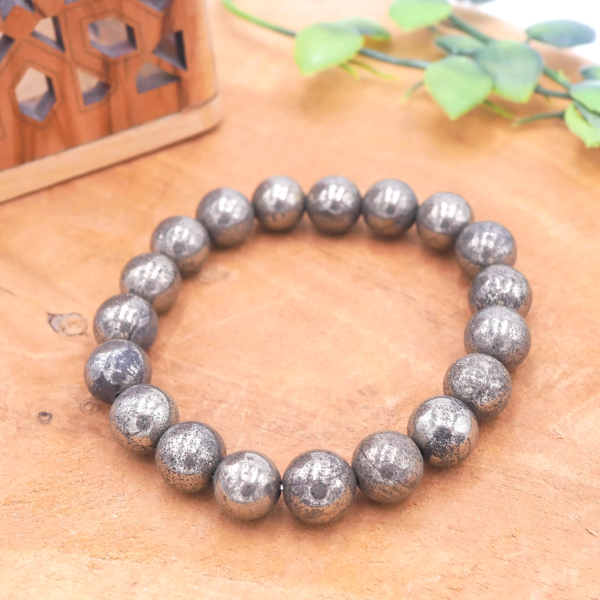 Bracelet en Pyrite naturelle de qualité supérieure, perles au lustre métallique doré montées sur fil élastique haute résistance.