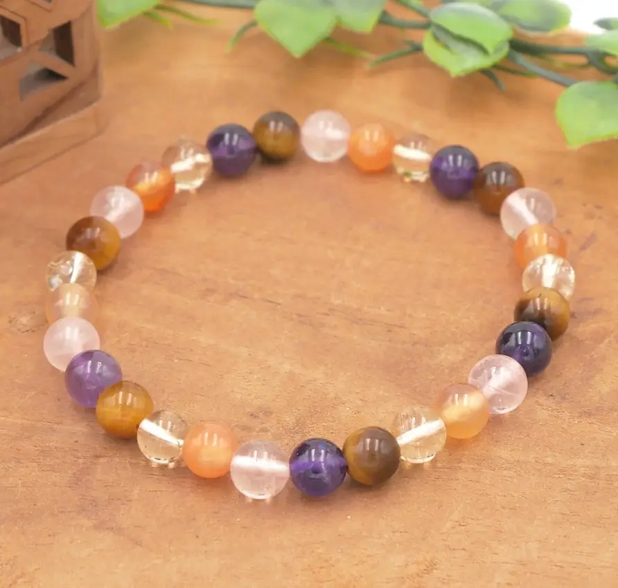 Bracelet en pierres naturelles de Améthyste, Citrine naturelle, Cornaline, Œil de tigre, Quartz rose, montées sur élastique multibrin résistant.